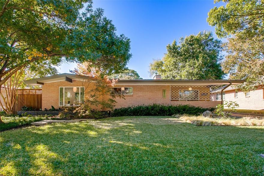Stunning 3 bedroom Mid Century Modern in sought after east Dallas location. Fall in love with 6210 Crestmont where period touches meet modern amenities. This beautifully updated home has been respectfully renovated to keep the MCM character while brining the home up to todays standards. The curb appeal is a true delight with large overhangs, expansive windows, metal entry screen and lush landscaping. Step inside and enjoy the warmth of the rich paneling walls, built-ins and oak hardwood floors. This inviting layout of the home is perfect for todays lifestyle with 2 living areas, both overlooking the rear yard, kitchen with terrazzo flooring and updated cabinetry, and generous sized bedrooms and updated baths. The primary suite is a true retreat featuring a beautifully updated bath inclusive of period style mid century touches and an expansive window overlooking the rear yard and fountain. The two guest bedrooms feature generous closet space and share the period hall bath with quartz counters. Enjoy the outdoors on your expansive rear patio and professionally designed rear yard inclusive of a serene bowl fountain, expansive grassy area and a home for the family chickens!
