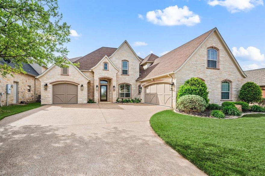 A rare opportunity in one of Granbury's most exclusive waterfront, golf course communities - Harbor Lakes!  If you love to entertain, this gem sleeps 22! and exceeds all expectations with modern decor, custom lighting, 6 bedrooms with closets, for a total of 8 bedrooms.  Other incredible features include a murphy bed,  5 full bathrooms, 2 dining rooms, an office, a multi-tier home theater with high-end sound, a game room with a wet bar, an incredible outdoor kitchen with pergola, a covered boat dock with double lifts, an automatic boat cover system, a completely remodeled heated pool, a gorgeous butler's pantry, all new appliances, custom window treatments, separate office upstairs, large walk-in closets, a primary ensuite with a bathroom you'll fall in love with!  If you've ever wanted high-end finishes, this will truly satisfy! All furniture and decor are negotiable including the smaller boat.   Buyer and Buyer's agent to verify all measurements, SF and schools.