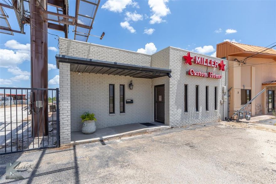 Updated spacious office building with lots of business opportunities. Building has reception room or could be a show room and spaces for  5 offices. New Luxury Vinyl floors , wood shutters, fresh paint. Attached is a warehouse or garage shop area to handle various needs for your business.  tall ceilings with overhead door. Tall enough to park trucks if needed.  Also a gated fenced in parking lot for equipment or trucks.  Excellent condition with lots to offer for many different kinds of businesses.  Location is great just off the loop.