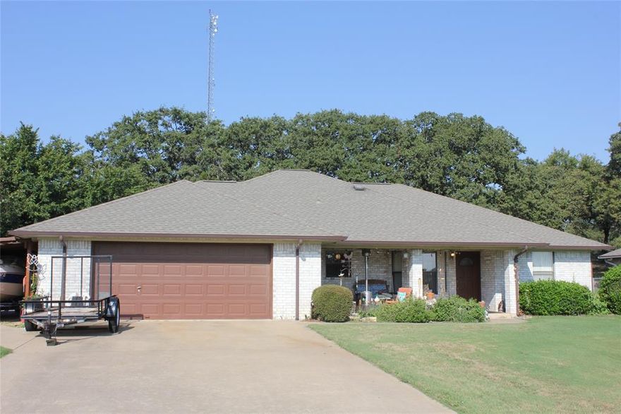 Superior Lake Kiowa location on a cul-de-sac. This home backs up to the 10th green & the front faces an unobstructed view of hole #3.  It feels larger than the tax roll sq footage indicates.  The 20x17 living room is open to the kitchen & dining & allows plenty of entertaining space.  A nice size kitchen island creates a gathering spot. The corner brick fireplace is woodburning & has a blower which the owner uses extensively to help heat in winter.  The primary bedroom is on a separate side of the house from the other 2 bedrooms and has an ensuite bath with 2 separate vanities with sinks and his-her closets.  The owner loves their multiple outdoor seating areas where they relax and entertain.  The front porch is large and allows for golf viewing.  The side patio is a great grilling & hangout spot.  The backyard porch is a great extra living space too that is heated and cooled.  The garage is extra lg with space for golf cart & workspace. Covered boat parking & 2 storage bldgs so plenty of room for extra stuff!
