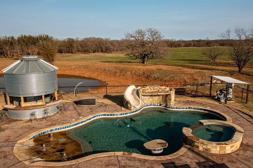 Exceptional 245± acre ranch in Young County offering the perfect blend of luxury living, ranching, and recreation. This turnkey property is ideal for hunting, cattle, horses, and entertaining.

The ranch features a 4,125± sq ft barndominium with an open-concept living and kitchen area designed for gathering and entertaining. The kitchen includes granite countertops, double ovens, dual sinks, an indoor grill, and overhead vent. The upstairs level offers a spacious game room with pool table and shuffleboard, two bedrooms, a full bath, and a second-story deck overlooking the pool, stock tank, and surrounding countryside.

Attached is a 2,500± sq ft garage and workshop. Above the garage is a private bunkroom suite with four built-in bunk beds and a full bathroom, ideal for guests or kids.

Outdoor amenities include a custom native-stone swimming pool, cabana, and outdoor bar area. Equestrian improvements include a 7-stall horse barn with tack room, wash rack, and tankless water heater. Cleared pastures provide excellent grazing for cattle.

The property offers diverse terrain with open pasture, hardwood cover, and excellent wildlife habitat for whitetail deer, turkey, and hogs. Three stock tanks provide fishing and water for livestock, and a scenic creek lined with mature hardwoods runs through the ranch.

Additional improvements include a recently remodeled 3-bedroom, 2-bath mobile home, bringing the total to seven bedrooms. Equipment barn included.

Property may be divided: 81± acres with the barndominium or 164± acres with the mobile home.

Owner financing may be considered.