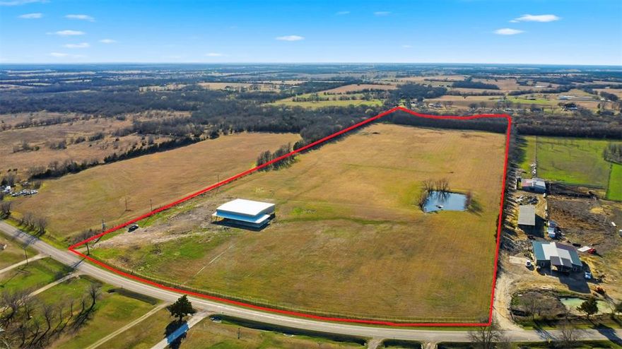 Turn-key 43-acre ranch setup on FM 905 just minutes from Paris, Texas, located in the desirable Prairiland ISD. The property is currently AG exempt and completely fenced with pipe frontage and 5-strand barbed wire perimeter fencing, making it ready to go. Utilities are already in place including electric, water, and septic. The massive shop offers approximately 60x80 enclosed space with 120x110 under roof, complete with three large door openings and extended covered areas ideal for equipment, livestock, trailers, or future build-out potential. A pond ads functionality and charm. With FM 905 frontage, open pasture and no known restrictions, possibilities are endless. Whether you’re looking for a ranch headquarters, business location, equipment storage, or a homesite with improvements already completed — this property checks the boxes.