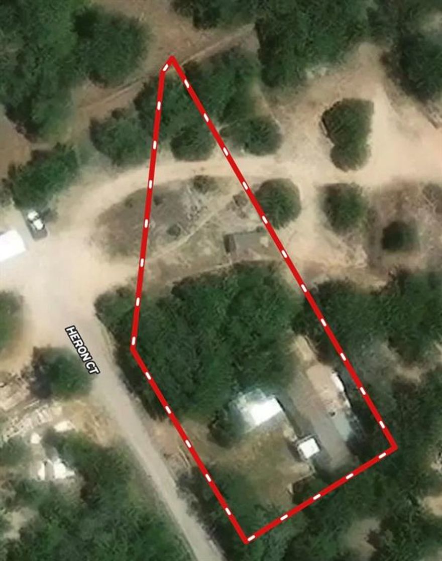 Great opportunity just minutes from the water in Granbury! This .5± acre property features a single-wide mobile home situated on a nicely treed lot, offering both privacy and shade. The backyard is fenced, making it ideal for pets or added security, and a carport provides convenient covered parking. With the ability to add a second mobile home, this property offers excellent flexibility for an investment rental, guest setup, or multi-unit income-producing property.
Located near the lake and a fishing pier, the property provides easy access to outdoor recreation including boating, fishing, and relaxing on the water at Lake Granbury. Granbury is known for its charming small-town feel paired with strong growth, featuring a vibrant historic downtown square, local dining, shopping, and year-round community events. Its proximity to Fort Worth—just under an hour away—makes it an attractive destination for both full-time residents and weekend visitors.
With continued new development in the area and increasing demand for affordable housing and rental properties, this tract presents a great opportunity to invest in one of North Texas’ most desirable lake communities. Whether you’re looking to expand your rental portfolio or create a flexible living setup.
