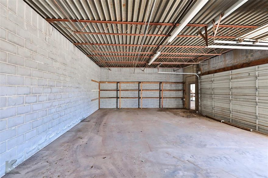 FOR LEASE: Industrial Warehouse space. Unit A - 3 offers an open area accessible through the garage doors that are west-facing. There is a 1-car door and a 2-car door. Room for a few vehicles or projects to be in process at one time. Additional storage space could be arranged in the parking lot. Potential opportunity for more space next door.