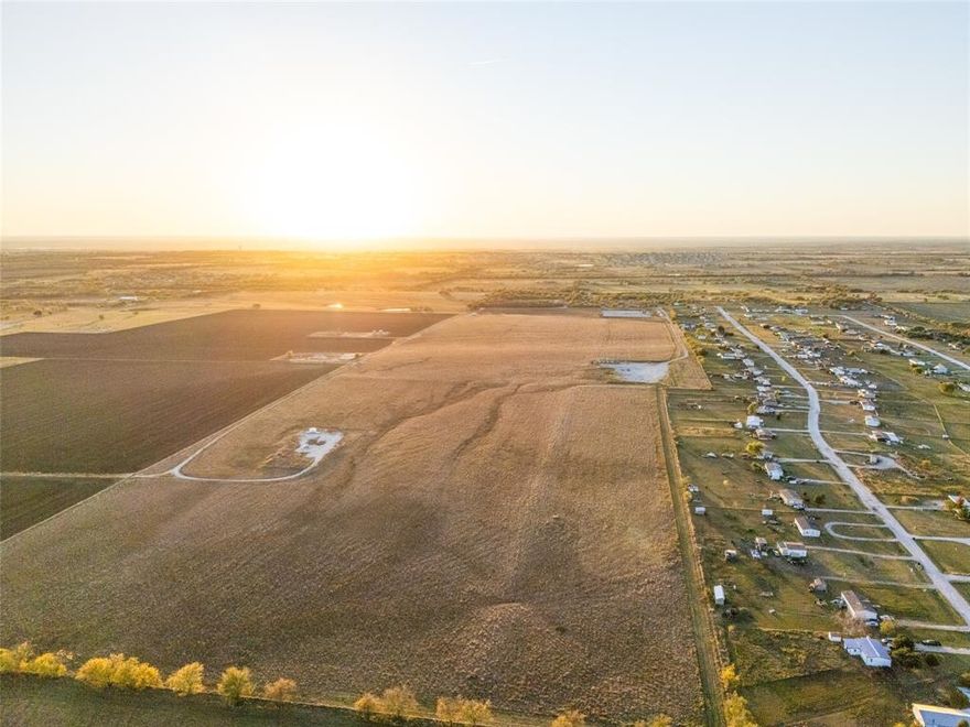Take a look at this exceptional 424 acre property located just a ½  mile off FM 407 and 2  miles from Highway 81, a prime location offering quick access to Rhome, Denton, and Fort Worth. This rare large-scale property sits right in the path of growth, surrounded by active and planned developments, making it a standout opportunity for investors and developers alike. The land features open, usable terrain with gentle elevation changes and excellent road frontage, ideal for residential or mixed-use development. With utilities expanding nearby, it offers both immediate and long-term potential. Rhome and Wise County are experiencing rapid expansion, with population growth exceeding 20% since 2020 and major investments from H-E-B, Ace Hardware, and master-planned communities like Reunion and Bluestem. A recent $17.5 million infrastructure bond and strong local economic growth make this area a prime destination for those seeking scale and opportunity. Just 6 miles from downtown Rhome, 31 miles from Fort Worth, and 58 miles from Dallas, this tract perfectly blends rural charm with urban convenience, a truly rare find in one of North Texas’s fastest-growing development corridors. No Minerals to Convey All showings are by appointment only.