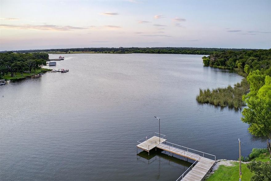 If you're dreaming of living near the lake without sacrificing convenience or affordability, this is the one you've been waiting for! Tucked inside the desirable Blue Water Oaks community on Lake Alvarado, this charming 2021-built home offers more than just a place to live—it offers a lifestyle.

Enjoy full access to everything the lake community has to offer: private boat launch, dock, community pool, park, and more—all just blocks away. Whether you're looking to spend your weekends on the water, kayaking at sunrise, fishing off the dock, or relaxing by the pool, it’s all right here.

The home features an open-concept studio layout with easy-care vinyl flooring and a full bathroom. Plus high-speed internet access means you're ready to unplug or plug in—whatever your lifestyle calls for.

Step outside and you'll find a peaceful, partially wooded lot with native landscaping, a gravel drive, and plenty of room to park your boat or RV. There’s also a garage or can be used as a workshop —ideal for weekend projects, outdoor gear, or lake toys.

With a low HOA fee that gives you access to all the community amenities, plus pays for sewer, water and trash, this is lakeside living made simple and stress-free. Whether you're seeking a low-maintenance full-time home, a weekend getaway, or a smart rental investment, this property checks all the boxes.

Come see it today—homes this close to the lake at this price don’t last long!