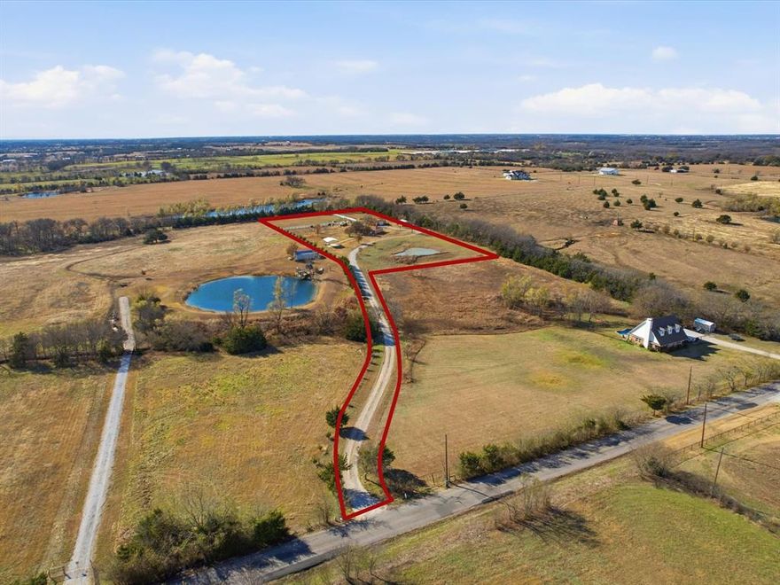 PRICE REDUCED! MOTIVATED SELLER! Fantastic investment opportunity in a fast-growing area of Collin County! This 4.3-acre tract is near a future planned thoroughfare per Collin County’s long-range plans, offering strong long-term potential for investment or land-hold. The property features a long private driveway leading to a tucked-away 2,105 sq ft home with all utilities; the home requires significant repairs or may need to be torn down, and its value is not considered in the pricing. Plenty of space to build your dream homestead. Additional features include a pond, a large, fenced area ideal for animals, a 728 sq ft barn, and a 1,200 sq ft shop with electric. Perfect for buyers seeking acreage with future upside in a high-growth area and in Blue Ridge ISD. Buyer to verify thoroughfare timelines and future use with Collin County.