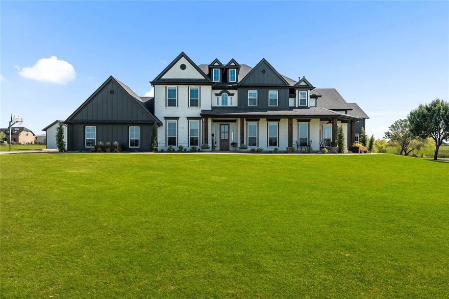A truly remarkable custom family estate set on a sprawling, manicured 3 acres in the prestigious North Preston Lakes Estates of Celina. This 6-bedroom, 4.5-bath residence offers an exceptional floor plan featuring both a primary suite and a secondary primary suite on the first floor, delivering rare flexibility for multigenerational living, executive guests, or split private retreats. From the moment you arrive, the home’s commanding presence and expansive covered front porch create an unforgettable first impression. Inside, a dramatic grand foyer with a sweeping curved staircase, soaring ceilings, and rich wood flooring sets the tone. The light-filled open living spaces are thoughtfully designed for both refined entertaining and everyday luxury living. The chef’s kitchen and main living areas flow seamlessly to the resort-style backyard, creating an ideal indoor-outdoor lifestyle. Step outside to a private oasis featuring a sparkling pool and spa, expansive patios, and beautifully landscaped grounds. An exceptional covered pavilion showcases a full outdoor kitchen, bar seating, fireplace, and ceiling fan—perfect for hosting unforgettable gatherings year-round. Completing the outdoor experience is a custom putting green with tee box and abundance of open space, offering endless recreation and tranquility. Additional features include spacious secondary bedrooms, multiple living spaces, game room, media room and flex spaces, a detached workshop or barn.  Come enjoy the sweeping views that provide privacy and serenity while remaining conveniently close to Celina’s downtown square including shopping, dining, and easy access to Celina ISD top-rated schools. Horses and donkeys welcome!