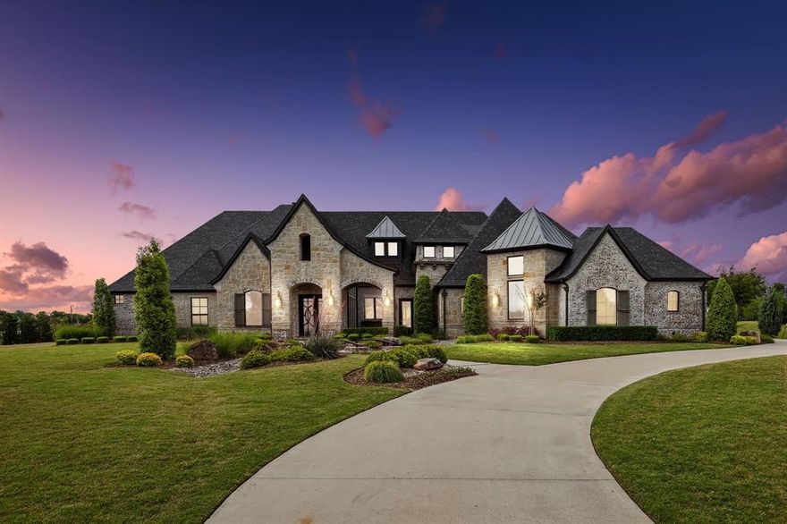 *Please View Video* Situated in prestigious Barry Farms, this stunning 6-bed, 6.2-bath home raises the bar w detailed craftsmanship, impeccable quality, and timeless design. Built by J. Anthony, this custom home enjoys outdoor views from almost every room, including your study w built-in shelving and a library ladder. Pamper yourself in a spa-inspired owner’s suite designed for relaxation. Both your game room and home theater are downstairs, w refreshments in a conveniently placed bar. At the back of your home, your welcoming living room is open to your kitchen and dining. A wall of windows slides completely open, allowing a seamless flow between your indoor and outdoor living. Travertine pavers create a huge covered patio that houses your outdoor table and a cozy seating area anchored by a fireplace. Beyond, your sparkling pool and a fire table beckon invitingly. With professional landscaping, vaulted ceilings, hardwood floors, and more, this home sets the standard for elegant living.