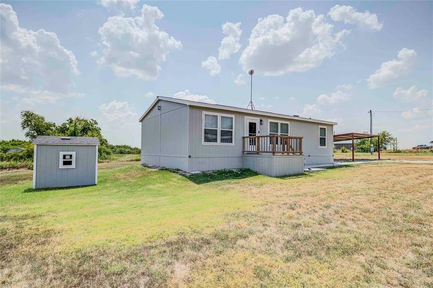 This well maintained 2022 doublewide sits on just over .5 acres of land is an excellent opportunity for someone looking for an affordable house to call home. Being south of Decatur with easy access to FM 2264 or HWY 287, the location is great for someone wanting the pleasurable experience of living in a country setting while needing to commute to Fort Worth. This house offers 3 bedrooms and 2 full baths with its own water well and septic system minimizing monthly bills. The manufacturer's home warranty is transferable with 3 years of coverage remaining. As a bonus, the seller is leaving all the appliances (3-years old) in place making the house turnkey for a first-time home buyer or investor looking for a great rental property.  A storm cellar is located at the rear of the property for added peace of mind when bad weather comes through. A 20 ft by 20 ft detached carport provides covered parking while wooden porches with handrails at the front and rear of the home make for safe and easy access to the home.