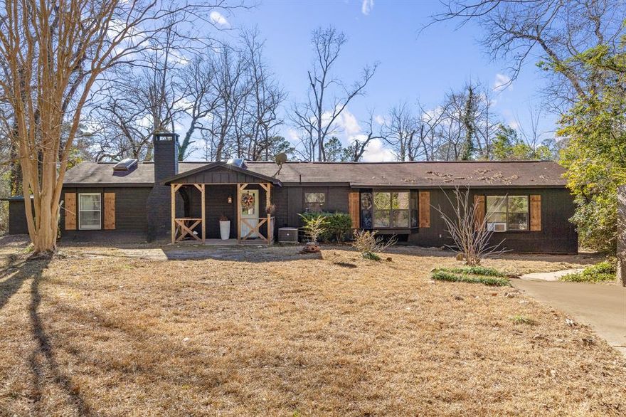 Updated and gorgeous inside! MOST OF THE FURNITURE CONVEYS WITH THE SALE OF THE HOME! This home is the perfect weekend retreat or year-round residence. Enjoy sunsets over the lake from your back patio! The living and dining space, along with a sunroom, give you plenty of room to entertain. Saltillo tile extends through much of the home. Updated kitchen has stylish appliances, open shelving, granite countertops, and a window seat breakfast nook. Built-ins near the dining area are the ideal spot for a coffee bar or snack station. One bedroom is large, split from the other bedrooms, and has a nearby bathroom. Two other bedrooms share a hall bath. Tucked in at the end of the road, you'll have privacy in a beautiful setting. The Grove Club Lake community offers a 40 acre lake with excellent fishing, 75 acres of hunting and recreation space, and another smaller lake along with a marsh that are ideal for duck hunting. **HOA owns the land.**