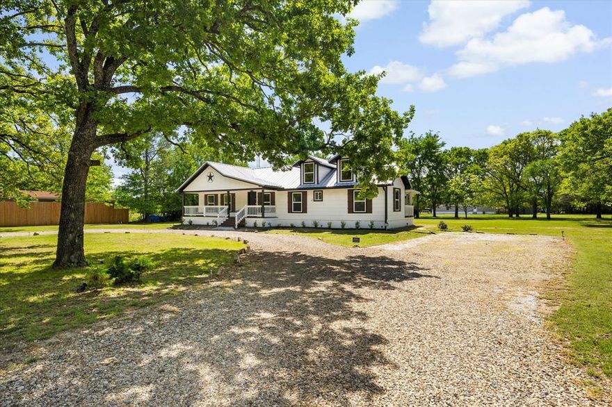GET YOUR ROCKING CHAIR READY! Enjoy peaceful country living with inviting front and rear porches—perfect for taking in stunning sunrises and savoring your morning coffee. This charming pier-and-beam home offers 3 bedrooms and 2 baths, nestled on just under one acre in a quaint, heavily treed setting abundant with wildlife.

Ideally located just 15 minutes east of Rockwall, this property provides the perfect balance of privacy and convenience. Inside, the bright and airy updated kitchen showcases granite countertops, stainless steel appliances, and luxury vinyl plank flooring. The Primary bedroom is oversized with a beautiful full bath with dual sinks, walk in shower, stand alone tub and walk in closet.

Step outside to a spacious, shaded backyard surrounded by mature trees, complete with a built-in fire pit—perfect for relaxing evenings under the stars while enjoying the beautiful night sky or you may choose torelax on the expansive front porch.  The owner has made numerous improvements, including a new aerobic septic system, reworked plumbing, a covered back porch, added privacy fencing, seamless gutters, and enhanced landscaping, along with many additional improvements!

Meticulously maintained and thoughtfully updated, this home is pristine and truly move-in ready—an ideal retreat for those seeking tranquility without sacrificing accessibility.