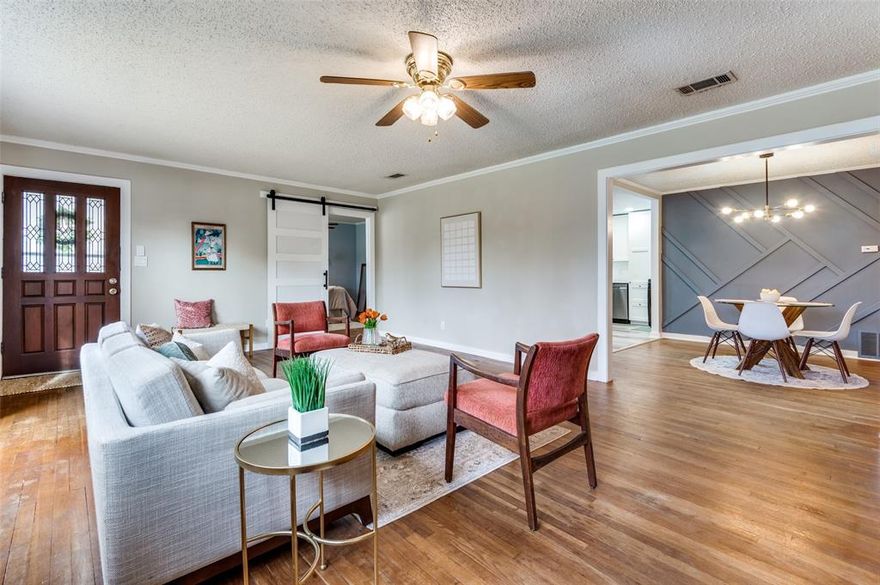 Welcome to this beautifully updated home, nestled on a spacious corner lot in the highly sought-after Meadowbrook community. This home perfectly blends vintage charm with modern amenities. Original hardwood floors cover most of the home, creating a warm and inviting atmosphere. The living room features a lovely wood-burning fireplace with tile surround, while an accent wall in the dining room adds personality and style. The completely renovated kitchen is a chef’s dream, boasting quartz countertops, stainless steel appliances, a gas range with pot filler, a large walk-in pantry with built-in organization, custom coffee bar with mini beverage fridge, recessed lighting, and luxury vinyl plank floors. The updated guest bath features luxury vinyl plank floors, recessed lighting, double vanities, plus a separate makeup vanity. The primary suite features a walk-in closet outfitted with an organization system and an adorable en-suite bath boasting beautiful wallpaper and original teal and black vintage tile. Additional highlights include a built-in hallway bookcase, new roof and gutters (2021), tankless water heater, and updated electrical in the kitchen. Outside, enjoy the peaceful ambiance of a quiet, one-way-in and out neighborhood that backs up to a greenbelt. The home is located within walking distance to Coffee Folk, a favorite local coffee spot, and just steps away from Tandy Hills Natural Area Park. The newly revitalized Meadowbrook Golf Course is just down the street. Conveniently located close to I-30, it is only a short drive to Downtown Fort Worth, the Cultural District, and the Medical District. Additional features include a 1-car garage with an attached 1-car carport. Don’t miss this opportunity to own a beautiful move-in ready home in one of Fort Worth’s most established and charming neighborhoods. 

*SELLERS HAVE AN ASSUMABLE FHA MORTGAGE WITH 2.99% RATE!* Please ask agent for details.