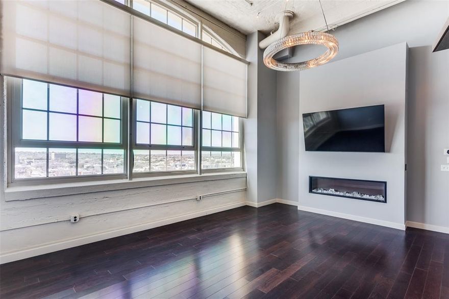 Experience elevated luxury in this top-floor 3-bedroom, 3-bathroom residence in the exclusive West Tower of  the iconic Montgomery Plaza — Fort Worth’s premier address for upscale urban living. Perched on the 8th floor, this expansive condo offers panoramic skyline views, soaring ceilings, and a refined open-concept layout ideal for both stylish entertaining and serene everyday living. Two of the three bedrooms are full ensuite retreats, thoughtfully designed for privacy and comfort. A third full bathroom ensures convenience for guests or a third bedroom occupant. Step into the flexible dining area or bonus living space, perfect for hosting elegant dinner parties or curating your dream home office. The electric fireplace adds a warm, modern touch, while motorized shades allow you to tailor the ambiance at the touch of a button. The chef’s kitchen boasts premium finishes, sleek cabinetry and a layout that flows effortlessly into the living area—framed by dramatic industrial windows and unbeatable natural light. A standout feature is the dedicated spacious full size laundry room with sink, which is a rare and valuable convenience in condo living. With ample space for storage and folding, it adds an extra layer of comfort and functionality not often found in similar units.  Enjoy the rare convenience of two side-by-side deeded parking spaces 2203 & 2204, a coveted luxury in this vibrant location. 
Montgomery Plaza residents also enjoy resort-style amenities including: A rooftop pool with 6 private cabanas and spa, 2 outdoor kitchens, multiple firepits, corn hole, putting green, herb garden, state-of-the-art fitness center, 24-hour concierge, owner’s lounge with bar and a 14 media room-theater.  All this, just steps from Fort Worth’s finest dining, shopping and cultural attractions. It's a true lock and leave lifestyle you will love! 
New HVAC in 2024.