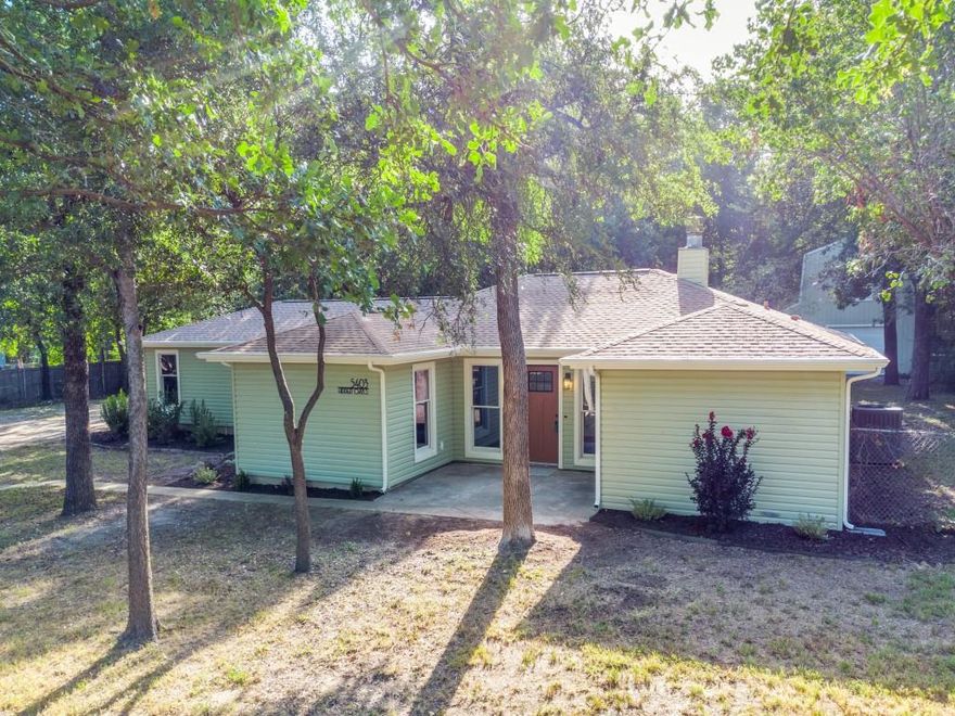 Don't miss this rare opportunity to own just under 2 acres in the heart of Arlington. This stunning 3 bed 2 bath home with a 2 story workshop is perfectly placed on this park like lot with mature trees and tranquil views. The home offers an open floor plan with split bedrooms, vaulted ceilings and fresh interior and exterior paint through out. The light and bright kitchen boast new quartz counters, new SS whirlpool appliances and tons on cabinet and counter space. The huge utility room includes quartz counters, separate utility sink and plenty of cabinets. The primary suite has an ensuite bath to die for, with an oversized walk in shower with bench, double vanities and large walk in closet. The open living and dining room offers a wood burning fireplace, and breathtaking views of the park like lot. No detail was left untouched. This property will definitely soothe the soul with the calming sound of nature, running creek and private bridge to access the back of the lot.