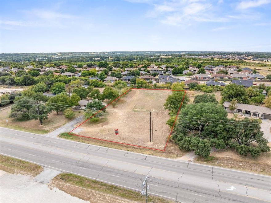 Excellent opportunity to own one acre of commercial land on highly traveled North Main Street in Weatherford. This flat and cleared lot is ready to go, offering outstanding visibility and convenient access for future business use. A brand new water well has been installed, and electricity is available with capacity for two meters. All TXDOT requirements have been completed, and driveway plans off Main Street have already been approved, with plans available to review. Located outside the city limits, this property provides added flexibility for a variety of commercial uses, making it a turnkey option for your next business investment. TXT Lonestar3 to 88000 for instant info or driveway plans.