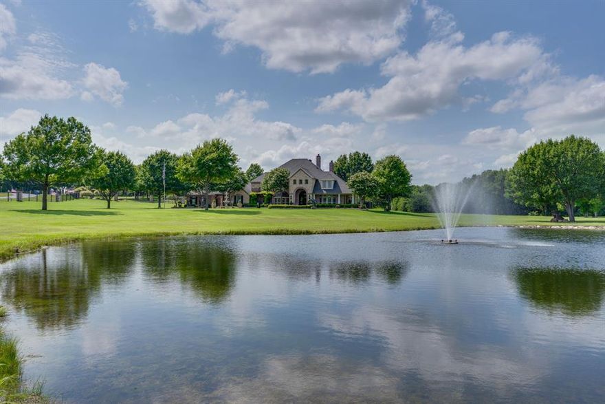 Experience elegance at this beautiful estate siting on 7.6 private acres with a pond! This 5-bed, 6-bath masterpiece boasts grand curb appeal, a circular driveway with a fountain, & a stunning brick & stone facade. Stepping into the grand entry into the home takes your breath away with the gorgeous travertine tile floor & stunning marble chandelier, beautiful formal living featuring an imported marble fireplace & marble chandelier & gorgeous wrought iron & wood staircase. The formal dining room features a butler pantry with wine cooler, perfect for entertaining & an amazing wine cellar!  The family room boasts soaring 20 foot ceilings, stunning custom woodwork & solid wood doors  throughout the whole home with a nice open living room concept & features a floor-to-ceiling 20 foot beautiful stone fireplace, wet bar area with ice maker & fridge and features a 150 gallon fresh water fish tank that is simply stunning. Expansive windows looking out to the amazing resort style pool 
& backyard paradise. The gourmet kitchen offers granite counters, custom cabinetry, built in refrigerator, pot filler, stainless high-end appliances including 6 gas burner cooktop & griddle. The primary suite stuns with a fireplace, sitting area, spa-like bath, & private patio access. Outdoors enjoy a resort-style pool with a spa, water features, & tanning ledge plus outdoor kitchen & covered pavilion includes fireplace, TV & sitting area. The fenced rod iron electronic entry gate ensures privacy and security. This estate also offers three bedrooms upstairs plus private office, kitchenette, game room. & a private balcony, plus an elevator to take you to second floor easily. This would be a great multigenerational living home! The gorgeous property features a pond with fountain & is stocked with fish, turtles and ducks.  Tons of storage and unique features make this home a real treasure.  A rare blend of luxury and tranquility, just 20 minutes south of Dallas. Schedule your private tour today!