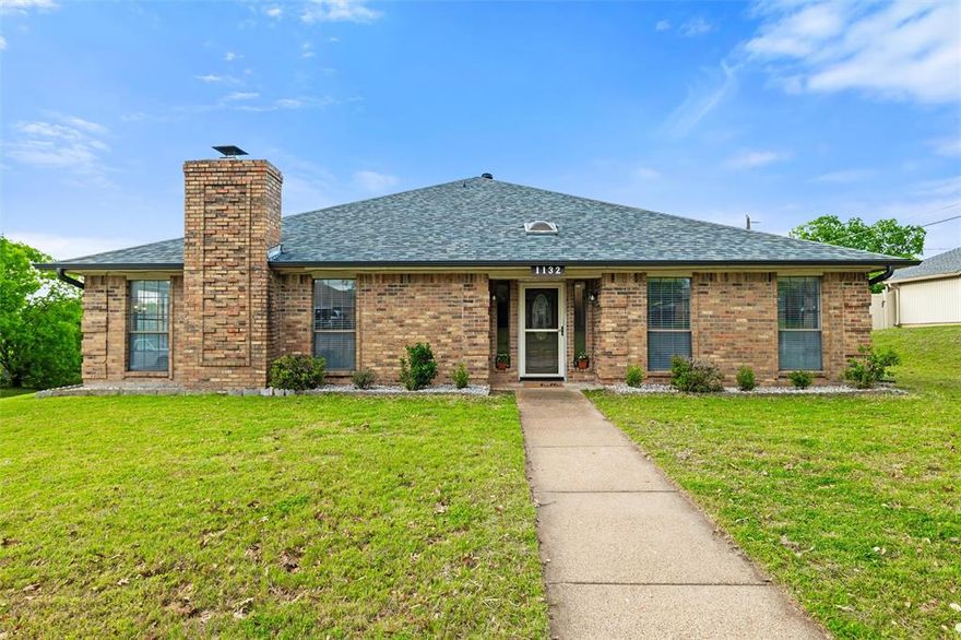 Welcome to 1132 Trinity Drive, a spacious brick home on a corner lot in the highly desirable Trinity Estates neighborhood of Fort Worth. Built in 1985, this 4-bedroom, 3-bath home offers 2,573 square feet of versatile living space and an unbeatable location just minutes from dining, shopping, entertainment, the YMCA, Benbrook Lake, and with direct access to the Trinity River Trail—perfect for walking, biking, and enjoying the outdoors. Recent updates include luxury vinyl plank flooring throughout the main living areas, multiple major system improvements, and extensive interior upgrades. The guest bathroom and both primary bathrooms have been fully renovated with updated vanities, tubs and showers, tile, and modern fixtures. The kitchen has been refreshed with new countertops, stove, sink, faucet, and range hood, providing a great foundation for everyday living. The flexible layout includes a bonus room perfect for a game room, office, or additional living space, while still offering the opportunity to add your personal finishing touches. The fenced backyard provides space for outdoor enjoyment and includes a storage building for added convenience. The attached 2-car garage features an additional 8x14 room ideal for a workshop, hobby space, or extra storage. Additional improvements include a replaced HVAC indoor unit, new water heater, and a new roof, offering peace of mind for the next owner. With its prime location, thoughtful updates, and outdoor access, this home is a fantastic opportunity in one of Fort Worth’s most established neighborhoods.
