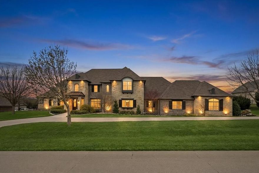 Bella Flora luxury with rare 1,000 sq ft climate-controlled shop! Exceptional John Askew custom home privately positioned within the guarded gates of Bella Flora and served by highly acclaimed Aledo ISD. Set on a private lot, this impressive 5,390 sq ft residence offers 4 bedrooms, 4.5 baths and beautifully designed living spaces that balance everyday comfort with elegant entertaining.
The main level showcases an expansive 1st-floor primary suite retreat featuring a spa-inspired bath with separate soaking tub, walk-in shower and a customized oversized walk-in closet designed for exceptional organization. An executive office includes a fully concealed tornado-safe room complete with large safe, seamlessly integrated for both security and discretion. Formal living and dining rooms provide elegant spaces for gatherings and entertaining with soaring ceilings and elegant wood accents.
The expansive family room captivates with dramatic exposed beam and brick accents,statement fireplace and windows that flood the space with natural light.The adjoining kitchen showcases gorgeous granite countertops, oversized island, generous prep space, abundant cabinetry and easy flow for everyday living.
Upstairs, a spacious secondary living area is accompanied by 3 generously sized bedrooms, each with an ensuite bath. Plantation shutters, timeless finishes, stunning wood floors, thoughtful built-ins & extensive storage throughout reflect the home’s impeccable design & craftsmanship.
A truly rare highlight is the 1,000 sq ft climate-controlled shop, complete with central heat & air, oversized garage door & car lift—ideal for car collectors, hobbyists, or additional garage space.
Outdoors, the expansive backyard offers exceptional space for recreation & relaxation, while the covered patio creates a true outdoor living retreat with built-in grill, comfortable seating area & gas fireplace—perfect for entertaining & enjoying peaceful Texas evenings. See documents for many more upgrades!