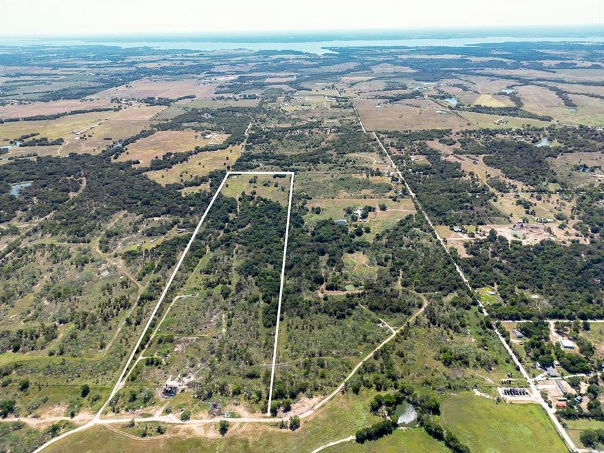Secluded 58 acre parcel to run your cattle on, hunt, or build your private retreat. Nestled in the Jane Smith Abstract on the outskirts of Corsicana, this property is located within a short drive to Richland Chambers Reservoir. There is an additional 18 acres for sale on SE County Road 3040 that adjoins the property and would secure road front access (See MLS 20726943). There is an easement to get to the property, however it may be an agreed upon with a handshake and nothing more. There are existing oil wells on the property that will not convey. Contact agent with more questions or to view the property.