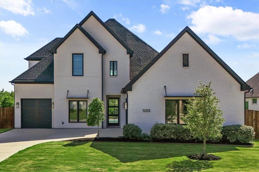 Beautifully thought out, custom newer construction home with the most amazing views of Joe Pool Lake! Entering the home to your left will be a secondary bed with private bath. As you go through to the living area you will see the 3 panel sliding glass door looking out to the patio. The kitchen is equipped with Kitchen aid appliances, quartz counters, and custom cabinetry. To the right of the living you will find the main bed and bath with garden tub, stand alone shower, and dual sinks. HUGE Master closet opens to the large utility room for a most efficient layout. Upstairs is the 2nd living with 3 panel glass door leading to the balcony. 2 rooms and a bath to follow. Pics don't do enough justice, come see this home in person today!