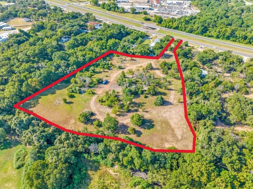 Discover a rare opportunity to build your vision on nearly 7 acres in highly desired Springtown, located about 25–30 minutes from Fort Worth. This prime location, situated on the west side of Highway 199, boasts impressive traffic counts of over 30,000 vehicles per day. Perfect for custom-home buyers, builders, developers or retail visionary projects, the property features no restrictions, giving you full flexibility to realize mixed-use, estate, multi-generational, or boutique retail plans. Located within Springtown ISD, this community combines small-town charm with strong civic support for high-quality development. Whether envisioning RV park, creative short-term rentals, mixed use, this parcel empowers your imagination. Don’t miss your chance at this rare, generational land—an ideal canvas to create something truly exceptional in a fast-growing North Texas market.