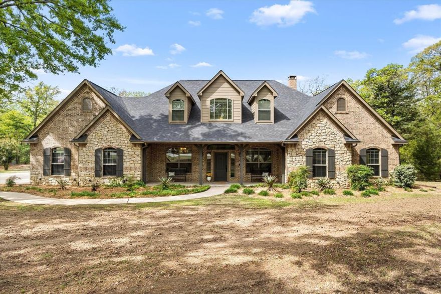 Welcome to Cedar Oaks in Greenville, TX, located within the highly regarded Lone Oak ISD. This custom built, single owner home has been exceptionally maintained and thoughtfully updated, offering the rare combination of quality craftsmanship, timeless design, and pride of ownership in one of the area’s most sought-after neighborhoods. Designed with both everyday living and entertaining in mind, the home is situated on 2.12 treed acres and offers 3 spacious bedrooms, plus a dedicated office with a closet that could easily serve as a 4th bedroom. You will also find a formal dining room, a large media room, and an eat-in kitchen that opens seamlessly to the living area. Inside, the dramatic living room features soaring 20-foot ceilings, stunning cedar beams, and a beautiful fireplace, creating a warm yet impressive focal point. The spacious primary suite offers a true retreat with a striking 36-inch double-sided fireplace shared between the bedroom and bath, complete with gas logs and blower. Outdoor living is just as exceptional, with an extended concrete patio designed for enjoying beautiful weather and a remarkable 18x33 above-ground pool set on a 6-inch concrete foundation with 2-inch foam flooring, surrounded by an expansive 1,650-square-foot pool deck. This is a rare opportunity to own a meticulously cared-for custom home in Cedar Oaks. *Additional 2 acres available, see MLS 21219588