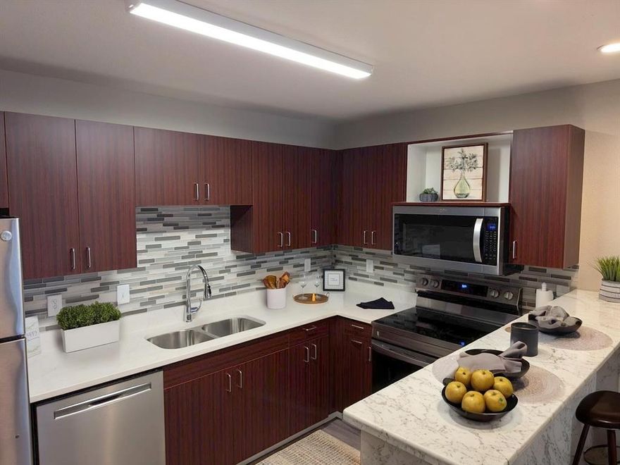 Well-Appointed New Construction 1-Bedroom, 1-Bath Condo – Unit #121
Discover modern comfort and convenience in this beautifully designed new condo. Featuring luxury vinyl wood-look flooring throughout, this home offers a sleek, low-maintenance living space perfect for any lifestyle.

Included Amenities: Refrigerator, washer, dryer, and flat-screen TV — everything you need to move right in!

Prime Location: Enjoy the ultimate convenience of living within walking distance to shops, dining, and everyday essentials.