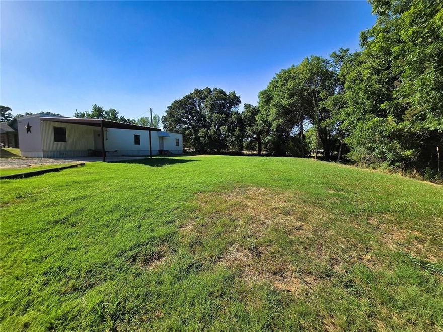 Tucked away on the end of a quiet street....this quaint 2 bedroom home offers privacy, a large yard and plenty of parking. Move in ready.