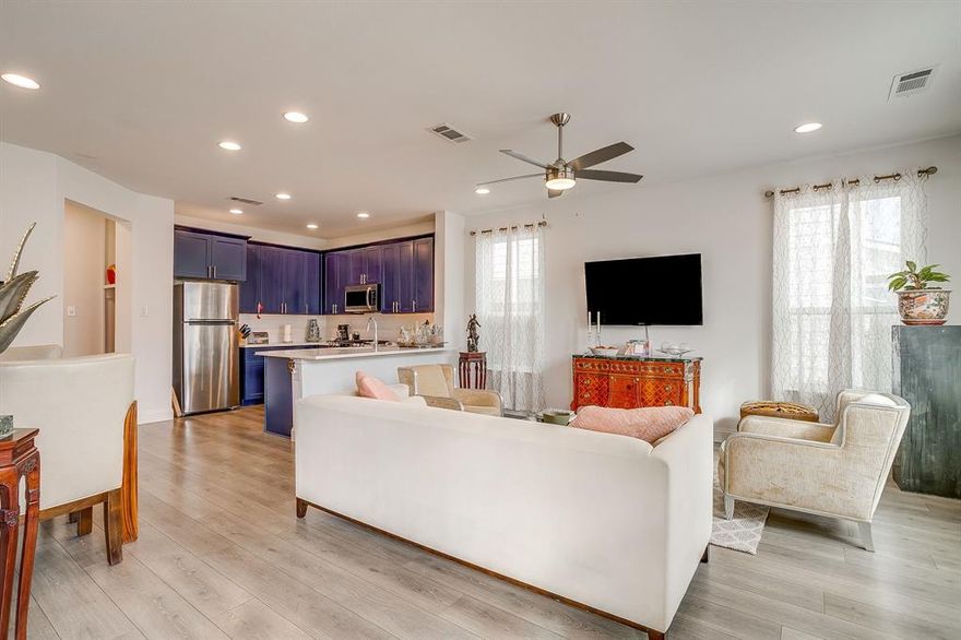 Experience refined, lock-and-leave living in this stunning, move-in-ready townhome located in the exclusive gated Overlook community of Northwest Fort Worth. Built in 2022 by Village Homes, this thoughtfully designed residence blends modern style with everyday functionality. The open-concept main living area is filled with natural light from oversized windows and soaring ceilings, creating an inviting space ideal for both entertaining and relaxing. The gourmet kitchen is a true centerpiece, featuring quartz countertops, a designer tiled backsplash, custom blue cabinetry, premium stainless steel appliances, a gas range, elegant vent hood, spacious walk-in pantry, and a convenient eat-in bar. A mudroom with additional storage connects the kitchen to the oversized two-car garage, offering practicality rarely found in townhome living. Upstairs, a versatile loft provides the perfect space for a home office, media room, or play area. The primary suite is a private retreat with a spa-inspired ensuite bath, oversized walk-in shower, and generous walk-in closet. Two additional bedrooms are well-appointed and share a spacious bath, while the upstairs utility room adds everyday convenience. Ideally located near Downtown Fort Worth with easy access on 199 or 820, Alliance, NAS JRB, Lockheed Martin, great restaurant and shopping options nearby, and outdoor recreation at Lake Worth and Eagle Mountain Lake, this exceptional home offers both luxury and location.
