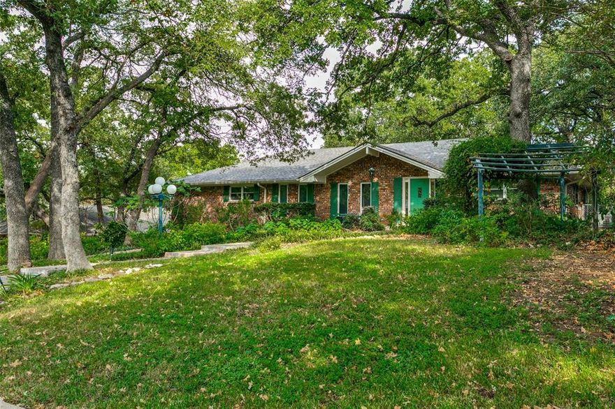 ***HUGE PRICE REDUCTION*** This large home with outstanding curb appeal presents an amazing opportunity to own a beautifully treed property in highly desirable Morrisdale Estates. The interior boasts a beautifully updated custom kitchen with stainless steel appliances, high-end granite countertops and custom cabinets with pull out shelves. Additionally, there is beautiful hardwood flooring in most areas except the carpeted bedrooms. Spacious secondary bedrooms with walk-in closets are split from the primary suite for privacy and solitude. The extra large primary suite consists of 3 closets, walk-in tub, two separate vanities and a linen closet. The pièce de résistance of this property is the extensively terraced backyard with decking connecting the levels including a gazebo for entertaining. Close to DFW airport, Globe Life Field, AT&T Stadium, Six Flags, Grapevine and a nearby TRE stop, this property has a wonderful location to access anywhere in the Metroplex. Charming curb appeal, beautiful landscaping and location…this home offers important attributes that are unique and nearly impossible to replicate.