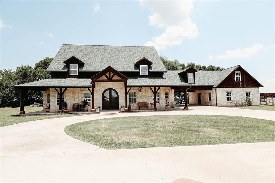 This property should feel like home to anyone looking for a place to settle. The main area features a 2 story home and an attached separate living quarters that can be used in whatever way you choose. This home with separate living quarters includes a total of 7 bedrooms, 4 full baths, and one half bath. This property screams custom all over it as you will see in the photos of white austin stone and stained cyprus wood. You can not go wrong with granite throughout the home, travertine tile, stained concrete, and laminate flooring for easy keeping. Entertain your guests on the large front and back porches. The master has his and her sinks, walk in shower, stand alone tub, and two separate master closets. Additional features include a large 36 x 40 shop, 2 14ft awnings, 2 8x10 roll up doors, and one giant 12x12 roll up door. If you have horses or dogs we have a great horse barn that can be used for either use. Call agent today to see. Too many features to mention!