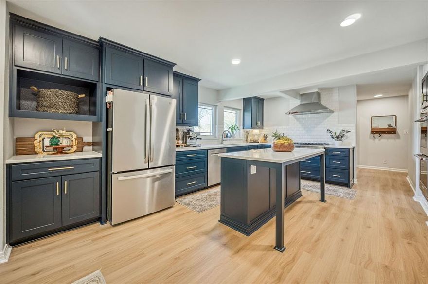 Beautiful 3-bedroom, 3-full bath home on a premium corner lot in sought-after Ryan Place—where classic character meets modern updates. Original hardwood floors and abundant natural light from large picture windows create a warm, inviting feel from the moment you step inside. At the heart of the home, the chef’s kitchen is built for both function and connection—featuring professional-grade appliances, including a Monogram 6-burner gas range and Zephyr vent hood—an exceptional feature for the area. With abundant cabinetry, open shelving, quartz countertops, and a large island with seating, the kitchen is both beautiful and functional. Whether you're preparing a quiet weeknight dinner or entertaining a crowd, this space is designed to bring everyone together. Enjoy your morning coffee in the cozy breakfast nook or unwind with dinner in the inviting dining area, where large picture windows frame beautiful, tree-filled views. A vintage bathroom adds character and a touch of timeless appeal. With two bedrooms offering ensuite baths, the layout provides flexibility and privacy—ideal for guests or multigenerational living. In addition, the bonus room would make an ideal work-from-home space, nursery, library, wine room or more. Step outside to a peaceful, shaded patio and fenced yard—perfect for relaxing or entertaining. The corner lot offers added space and curb appeal, along with a rare attached side-entry 2-car garage with extra storage—perfect for keeping everything organized. Ideally located with easy access to major highways, you’re just minutes from top dining, shopping, coffee shops, and local attractions including the Fort Worth Zoo—putting all the excitement Fort Worth has to offer right at your fingertips. With major system updates already completed, you can enjoy peace of mind and focus on making this home your own. This is a rare opportunity to own a beautifully updated, timeless home in one of Fort Worth’s most iconic and welcoming communities.