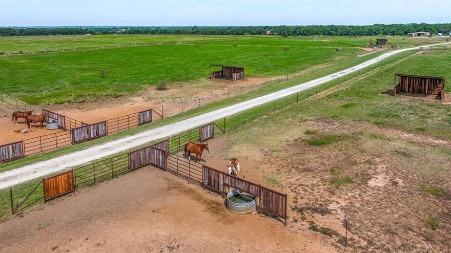 Sitting on nearly 30 acres and designed with horse lovers in mind, you'll find a 4-stall barn (convertible to 8), hay barn, powered shop, and 10 turnouts with sheds and automatic waters. The cutting pen is ready for the cutting enthusiasts, and there's plenty of sandy, flat ground for the team ropers or cowhorse folks to build a full-size arena. The pastures can be connected with the simple opening of a gate, and livestock are easy to move through the alleyway between pens. Enjoy quiet mornings on the wraparound porch or cook up something special in the large kitchen with a walk-in pantry and open living area made for gathering.