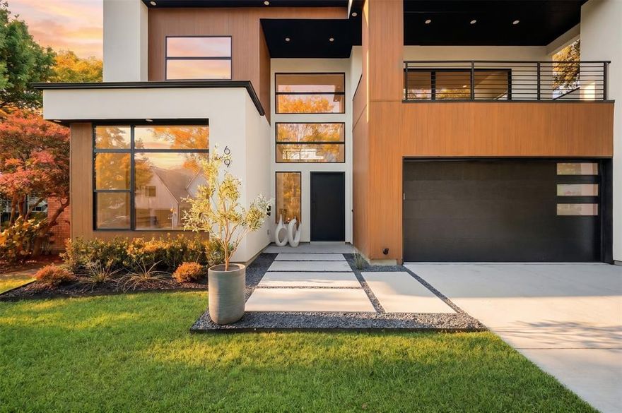 Located in the highly sought-after C Streets and zoned to the acclaimed Lakewood Elementary, this stunning new construction by Avant Group offers 4,725 square feet of modern luxury just minutes from White Rock Lake, Lakewood Village, and Dallas’ premier dining and retail. Thoughtfully designed with natural elements and bold architectural features, this 5-bedroom, 5-bath residence balances everyday functionality with elevated living. Soaring ceilings, white oak hardwood floors, and a spacious open-concept layout seamlessly connect the kitchen, dining, and family rooms.
The gourmet kitchen is a showpiece, featuring hand-built cabinetry, a huge quartz island, WOLF® dual fuel range, 48-inch built-in Café® refrigerator, dry bar with LED-lit floating shelves and wine cooler, plus a walk-in pantry with generous storage and garage pass-through. Downstairs, the luxurious primary suite stuns with a soaring vaulted ceiling, sliding glass doors leading to backyard, and spa-like bathroom complete with floating vanity, a vessel tub, oversized rainfall shower, and a custom walk-in closet. Also on the main level: a versatile guest suite or private office with ensuite bath and a large laundry room. Upstairs, a game room with wet bar opens to a spacious covered veranda, while three additional bedrooms each feature ensuite baths and walk-in closets. Built with performance and peace of mind in mind, this home includes a Control4® Smart Home system, CAT-6E pre-wiring, foam insulation, dual tankless water heaters, piered-slab foundation, and a Maverick® 1-2-10 Builder’s Warranty. A masterful blend of design, technology, and location—6906 Clayton Ave delivers refined living in one of Dallas’ most desirable neighborhoods.