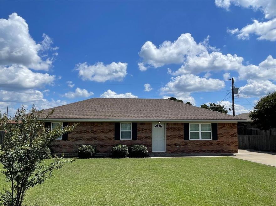 Move In Ready, All electric Brick home with open concept living & kitchen.  Many kitchen cabinets & plenty of room for a large table or adding an island.  Applicances include an electric range with microwave above, refrigerator, and dishwasher.  Double doors open to the laundry closet conveniently located for managing a busy household.  Tile flooring in the living rm, kitchen, & hallway.  Carpet & ceiling fans in the bedrooms.  Bedrooms are off a central hall.  Hall bath with tub & shower combo.  Primary bedroom with ensuite bath, tub & shower combo.  This home has been very well maintained, interior & exterior painted in 2022, Roof replaced in 2022.  Paved driveway, privacy fenced backyard, & storage bldg.