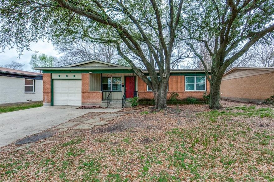 Wait until you see this gem! No carpet, hard floors throughout. Tile counters in the spacious kitchen with a gas range, the bathroom has been remodeled and the house has fresh paint. There's a huge backyard with enough room for the kids to play. This home is close and convenient to everything, don't miss this one!!