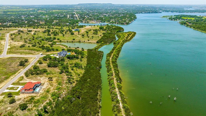 Wake up to the most breathtaking views of Lake Granbury—where soft breezes and painted sunsets set the scene for everyday living. Tucked inside the quiet, serene community of Luker Ranch, this spacious 1+ acre lot is the perfect canvas to build the home you’ve been dreaming of. The build site is flat, keeping construction simple, while the surrounding landscape feels like a retreat away from the hustle. Commuting is easy with quick access to Hwy 67, the Chisholm Trail Parkway, and a straight shot into Dallas or Fort Worth. Yet, just minutes away, Granbury offers small-town charm with live music, theater, shopping, and dining. Luker Ranch truly feels like a best-kept secret—peaceful, inviting, and ready for your forever home. Bring your plans, your vision, and your builder—the time to make it yours is now.
