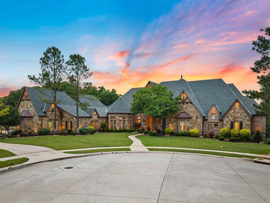 Set on nearly an acre at the end of a cul-de-sac, this single story estate in the gated enclave of Castleton Manor offers a rare blend of privacy, elegance, and resort-style living. Expansive outdoor living spaces overlook serene pond and park views! A fully equipped outdoor kitchen featuring a cooktop, refrigerator, sink, and ample storage is anchored by a heated diving pool with an automatic cover, beautifully remodeled by Claffey Pools. A five-hole putting green with a mini tee box adds a distinctive recreational touch. The property enjoys direct gated access to the community pond, park, and playground! Inside, soaring 12-15 ft ceilings and rich 5 inch walnut flooring define the home’s refined interior. The private primary suite is a true retreat, complete with a spa-inspired bath featuring an 8-foot Bain Ultra jetted tub, Kohler shower system with body jets, an in-bath refrigerator, and a reinforced steel safe room discreetly integrated into the custom closet. Each bedroom is thoughtfully designed with its own en suite bath. The chef’s kitchen is both functional and sophisticated, appointed with Alderwood cabinetry, a large walk-in pantry, dual ASKO dishwashers, a Viking Professional six-burner gas range, Thermador refrigerator and freezer columns, GE Monogram convection oven-microwave, and a Wine Captain. Entertaining continues in the spacious gameroom with a wet bar & beverage fridge, and a designated Music Room. A richly appointed wood-paneled office showcases coffered ceilings, a fireplace, and custom built-ins, while energy-efficient Pella windows and doors and a radiant barrier enhance comfort throughout the home. Car enthusiasts will appreciate the 4 car garage, gated driveway, and storage rooms. Above the garage, a generous living area with a full bath, wet bar, and built-ins offers flexible use! Located just minutes from the DFW International Airport. Nearby Southlake Town Square and Downtown Historic Grapevine offer endless shopping and dining options!