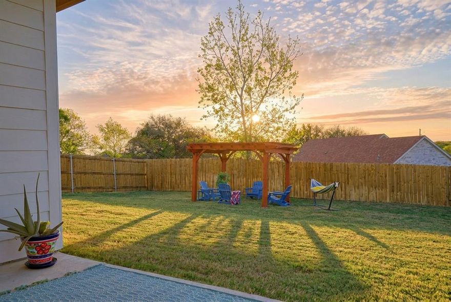 If you’ve ever dreamed of a home with a view, 2415 Beverly is an elevated sanctuary with a panoramic sunrise view all year long. Every morning is unique, offering a fresh start and a peaceful beginning to your day.

Expansive windows bring in natural light from morning to evening, creating a bright and inviting atmosphere throughout the home. The open concept layout allows for seamless flow between the living, dining, and kitchen areas, with the kitchen serving as the heart of the home, perfect for both everyday living and entertaining.

Built in 2023, this meticulously maintained single story home features 3 bedrooms, 2 full bathrooms, and a 2 car garage. The spacious primary suite includes a dual sink vanity, functional layout, and a walk in closet designed for organization and ease.

The kitchen is thoughtfully designed with a large chef style island, farmhouse sink with accessory features, matching stainless steel appliances, custom backsplash, soft close cabinets and drawers, built in trash drawer, and a walk in pantry providing ample storage.

Positioned on an elevated lot, this home offers wide open Texas skies, added privacy, and a large usable yard. Outdoor living is enhanced with a covered patio and pergola, creating the perfect setting for relaxing mornings or gathering with family and friends.

Located in the gated Canyon Creek community, residents enjoy access to Lake Granbury, a boat dock, parks, basketball and pickleball courts, and two community pools.

Homes that combine a newer build, elevated lot, functional layout, and consistent sunrise horizon views are rare. This is an opportunity to own a home that offers both comfort and a unique everyday experience.