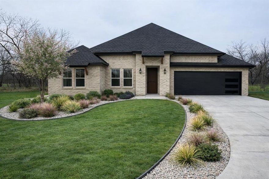 Beautiful new construction featuring 12-ft ceilings, open-concept living, and a modern electric fireplace. Chef’s kitchen with quartz countertops, oversized island, and stainless appliance package. Primary suite offers dual vanities, soaking tub, and walk-in shower. Includes outdoor kitchen, covered patio, and fully fenced backyard. Energy-efficient construction with spray foam insulation, Carrier HVAC, and irrigation system.