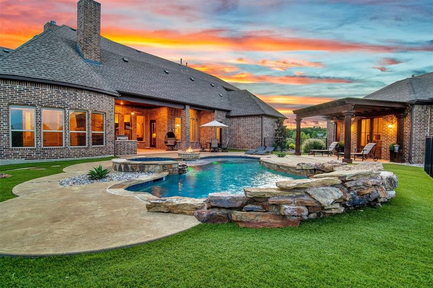 Picture yourself living in this Sprawling Estate-Style Home in desirable Belmont Park. Truly made for both entertaining and everyday living, with plenty of space and fabulous views of the sun rising from the east. Situated on a 2-acre lot in award-winning Lovejoy ISD. Every detail was carefully selected and quality crafted. Beautiful hardwood floors, wood-beamed ceilings, and plenty of natural light flow throughout the open, airy layout. The kitchen will inspire your inner chef, complete with a butler's pantry, wine room, and coffee bar. Enjoy family movie night in the well-equipped media room. Be the envy of your friends with a 6-car garage, including two oversized, with epoxy flooring and temperature controlled. Each is set for the toy enthusiast in mind! Need room for guests? The detached guest suite offers a mini kitchen and full bath. Cool off in the hot texas heat in the sparkling pool, and snuggle up by the fire pit on those chilly winter nights. This is your Dream Home!