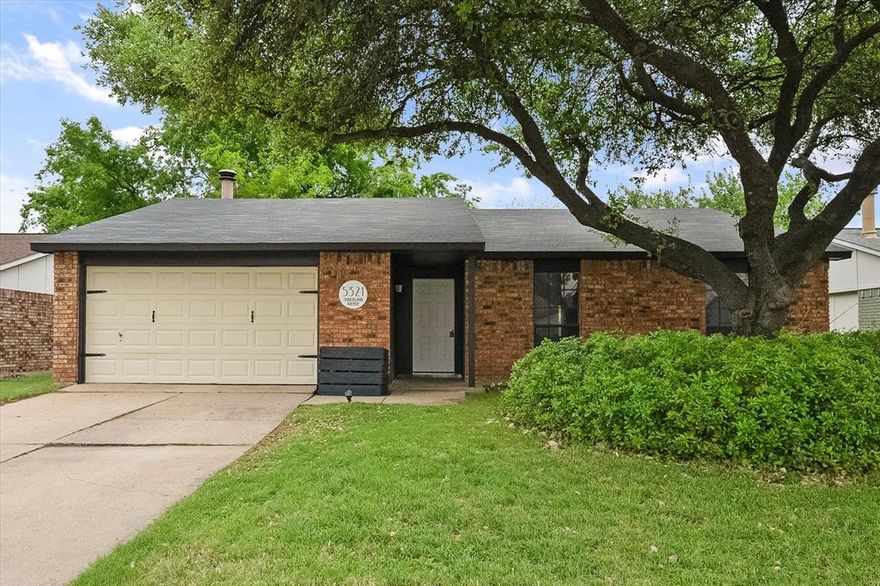 Come see this gem with recent updates and space in all the right places! Kitchen is open concept and updated in 2026.  Beautiful flooring is luxury plank created to be durable in addition to looking good.  Corner wood burning fireplace is perfect for those cold winter nights, and has been enhanced to add so much character to the property.  All three bedrooms are generously sized, and the garage is oversized to accommodate a workbench.  All carpet in the bedrooms replaced in January 2026! The back yard is huge with an extended patio, spot for a fire pit, and a large wooden deck located under a mature shade tree. Plenty of space for dogs, get togethers, and gardens! Easy freeway access for commuters right in the heart of The Colony. Schedule a showing today!