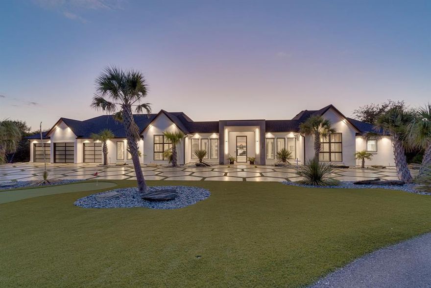 WOW. EXQUISITE WATERFRONT CUSTOM HOME IN EXCLUSIVE GATED GOLF & LAKE COMMUNITY OF WHITE BLUFF RESORT. Two award winning golf courses! Stunning views of Lake Whitney. The home is surrounded Army Corp of Engineers land with gorgeous trees for ultimate privacy. Lock and leave with low maintenance living.  Conveniently located between DFW and Austin. The home exudes modern elegance with executive craftsmanship.  Every bell and whistle that you can imagine.  Impeccably designed and built to relax and unwind...or entertain too. Custom designed with one-level living and amazing views from every window. Upon entering you will see the water and hill country views.  Fantastic gourmet kitchen with custom granite countertops, huge island, wine wall, designer lighting and tons of storage.  Cozy up to the fireplace while still enjoying the lake views. Primary bedroom is a show stopper with panoramic views.  Awesome primary bath with floor to ceiling tile, steam shower, tub, and  2 HUGE closets.  Notice the custom barrel tile ceilings. Spacious secondary bedrooms all with en-suite baths.  Work from home with your wonderful home office--plus a second office or studio or flex space.  The outside is paradise. Stunning infinity pool with outdoor kitchen, covered patio, open patio, putting greens, and turf grass for low maintenance.  Natural grass area too. Immaculate 4 car garage perfect for you car collection or workshop.  The resort community offers a large marina, restaurant ,4 swimming pools, tennis, pickle ball, meeting facilities and The Lighthouse Pub & Deck, 24-7 gated access, volunteer fire dept and helipad.  The community sits on 3,450 acres, and four miles of shoreline on Lake Whitney. Amazing wildlife like deer, turkey, birds to watch and enjoy. COME SEE THIS ONE-OF-A-KIND CUSTOM HOME! (With acceptable offer, home can possibly be sold with most furniture-excluding a few items. Ask Agent)