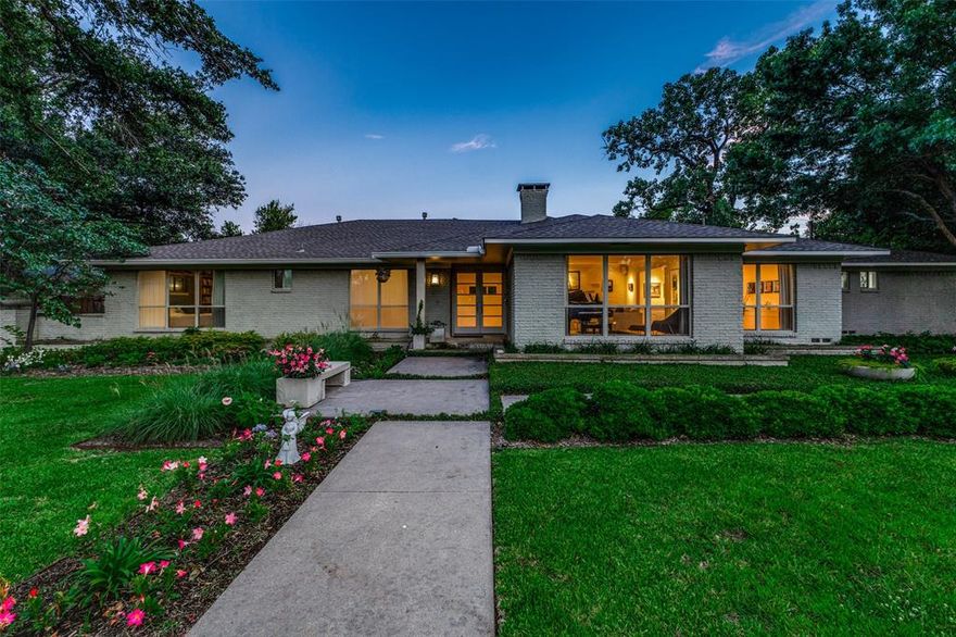 Beautifully updated and redesigned transitional home with lush landscaping and tons of natural light. This home has generous size rooms, hardwood floors throughout and is in move-in ready condition. Begin your tour in the entry hall which flows into a spacious living room, with fireplace, and dining room, both with large windows looking out to the front of the home. Adjacent is an open kitchen with custom cabinetry, granite countertops, and stainless-steel appliances. Off the kitchen is a utility room with walk-in pantry and a bonus room that makes a perfect home office with built in desk and cabinets. The kitchen opens to a spacious family room with fireplace, vaulted ceiling, spectacular built-ins, and a wall of glass doors leading to the backyard.  A half bath is conveniently located off the living areas for your guests. The kitchen also leads to a wonderful playroom with built in cabinets, just perfect for board games or storage. This playroom has a full bath attached and could easily be another bedroom. There is also heated and cooled storage space above the playroom. On the east side of the home are two bedrooms with a jack and jill bath, and two additional bedrooms, currently used as offices and hall bath. One office has large windows and a door which leads to the tranquil backyard and makes a perfect home study. The master suite was created as an oasis with fireplace, hidden television area, dual automatic blinds which allow for light to flow through or total blackout for comfortable sleeping. The ensuite bath is like walking into a spa with heated floors, separate soaking tub and shower, and dual sinks. Two walk-in closets, each with their own skylights, custom built-ins, and a hidden mediation or exercise room with a window, complete the suite. The backyard is its' own oasis, with a heated pool, both astro turf and natural grass, and an outdoor shower for convenience. Come see this beautifully designed house and make it your new home.