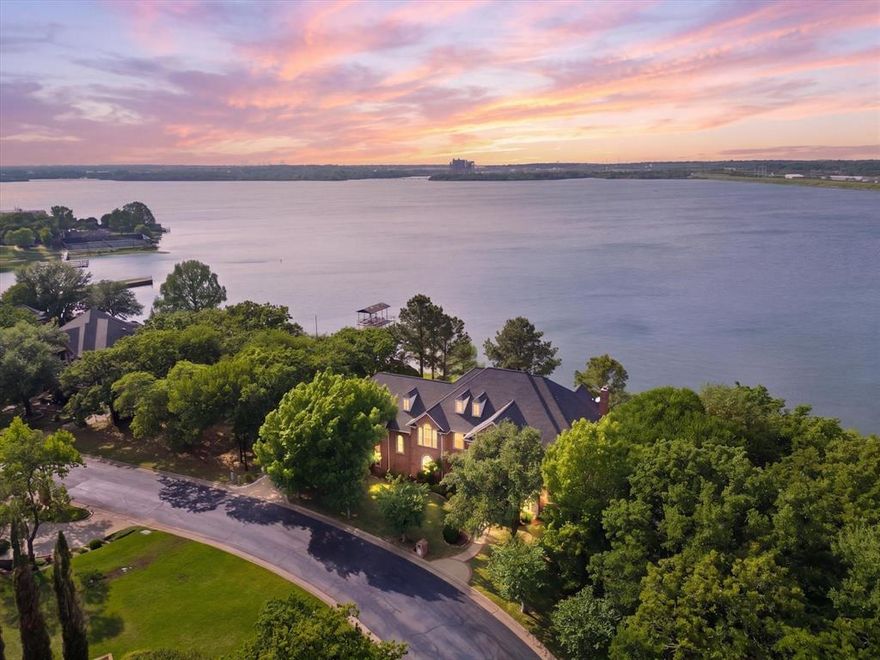 Welcome to your private lakefront retreat in the exclusive gated community on Lake Arlington. This beautifully updated home has been thoughtfully redesigned with high-end finishes and extensive upgrades throughout, including new flooring, fresh interior paint, new cabinetry, a stunning island with marble countertops, and brand-new appliances.

Panoramic windows span the entire back of the home, showcasing breathtaking water views while filling the space with natural light.

Designed for both everyday living and effortless entertaining, the property features a sparkling pool and expansive outdoor living areas perfect for hosting or relaxing in a serene setting. Situated on a large, private lot, this home offers exceptional privacy and a true escape from the everyday.

Residents enjoy exclusive access to a private community dock and clubhouse, adding convenience and enhancing the lake lifestyle. This rare, move-in-ready home combines luxury, comfort, and unbeatable views—an exceptional opportunity on Lake Arlington.