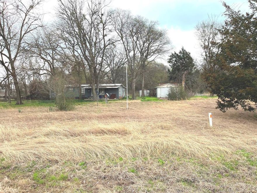 Take a look at this affordable and versatile property, providing a restful country lifestyle while offering convenient access to the City of Terrell via I-20 for all your necessities.  This property features 2.36 acres with a metal workshop, a 2 bed-2 bath manufactured home with add-on, and an abundance of mature trees for summertime shade.  This site is perfect for building your new residence, raising your favorite livestock, engaging in recreational activities, expanding your horizons, and much more!!!  Manufactured homes and barndominiums are welcome on this flexible plot of land.  Located just 10-15 minutes from Terrell and within a 30-40 minute drive to the Dallas Metroplex, this property offers many opportunities.  Do not miss out...view this gem today!