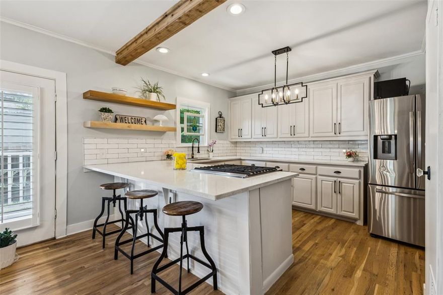 Step into timeless charm with this beautifully updated 3 bedroom, 2 bath home nestled in McKinney’s sought-after Historic District. From the white picket fence and covered front porch to the designer finishes inside, this home perfectly blends 1930s character with modern updates. Inside, you’ll love the open concept, all the light, hardwood floors, exposed beams, and custom woodwork, paired with a chef’s kitchen featuring custom cabinetry, floating shelves, stainless steel appliances, gas stove, and pantry. The primary suite offers a spa-like ensuite bath and walk-in closet, while secondary bedrooms provide great flexibility. Major updates include: new HVAC, updated plumbing & electrical, tankless water heater, solar panels, new insulation, fresh paint, all-new windows with plantation shutters, and more—move-in ready! Outdoors, enjoy your own private oasis with a pergola, mature trees, and nearly half an acre of space—perfect for gatherings, play, or quiet evenings under the stars. All just a short stroll to Historic Downtown McKinney’s shops, cafés, schools, and events. This home has it all! Ask about the ASSUMABLE RATE!