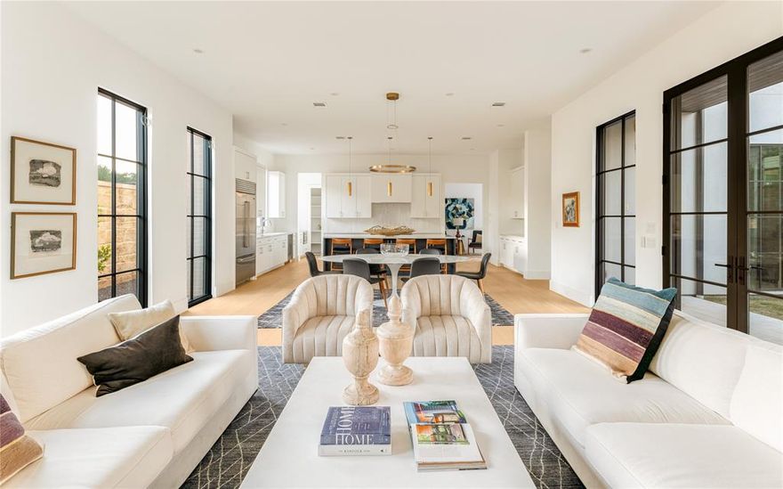 Newly completed in 2023, this light-filled home combines modern details with timeless elegance to create a truly luxurious home. Complete with hardwood floors throughout, this 4397 square foot home resides in Preston Hollow Village and has direct access & walkability to many shops and restaurants. Boasting eleven foot ceilings, the downstairs living area is filled with light from floor-to-ceiling windows wired for electric blinds throughout. The kitchen features Wolf appliances, ice maker, quartz countertops, ample storage and a Sub-zero refrigerator. Directly off the dining area, you will find a covered patio, perfectly sized for outdoor living or pets. The primary bedroom features a luxurious ensuite bath with spacious closet and dual vanities. Upstairs, there are three additional bedrooms each with an ensuite bath and large living area or media room for the whole family to enjoy. This house is truly spectacular!