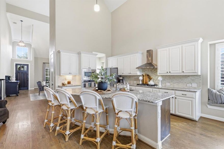 Nestled on an oversized cul de sac lot in a quiet, established neighborhood, this home offers a rare combination of privacy, space, and resort style outdoor living. The uniquely shaped lot is one of the largest in the community, creating an expansive backyard retreat designed for both entertaining and everyday enjoyment. The outdoor living space features a heated in ground pool with attached spa, recently updated equipment, and multiple areas to relax or gather. A covered patio with built in outdoor kitchen with ample bar seating allows for year round entertaining, while the firepit and open yard space create the perfect setting for evenings under the stars and weekend smore gatherings.

Inside, soaring vaulted ceilings and an open concept layout create a light filled interior with a seamless flow between living and kitchen spaces. The main living area is anchored by a dreamy floor to ceiling stone fireplace with gas logs, adding warmth and architectural interest. The kitchen is equipped with granite countertops, gas cooking, and functional design oversized island that supports both daily living and hosting.

The main level features a private primary suite, dedicated home office, and laundry room for added convenience. Upstairs, a spacious loft overlooks the living area below and is complemented by three additional bedrooms, including two with ensuite jack and jill baths, offering flexible living options.

Additional highlights include decorative lighting and ceiling fans, plantation shutters, tankless water heater, dual HVAC systems, and a fully fenced backyard. Located near greenbelt trails, parks, this home delivers space, functionality, and an elevated indoor outdoor lifestyle.